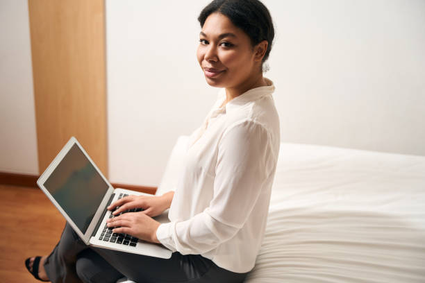 istock Pleased business lady working on her laptop 1471424016