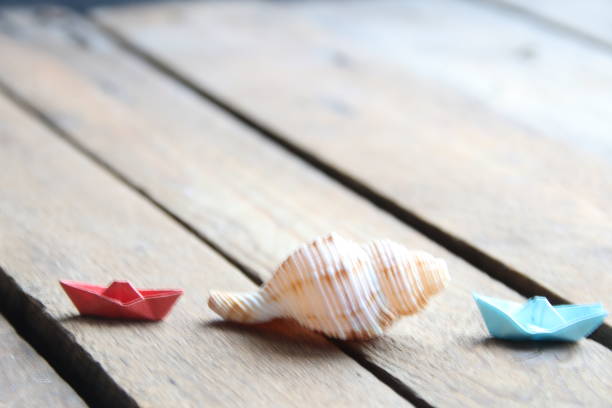 istock Summer background. Seashell on a wooden background. 1471424156