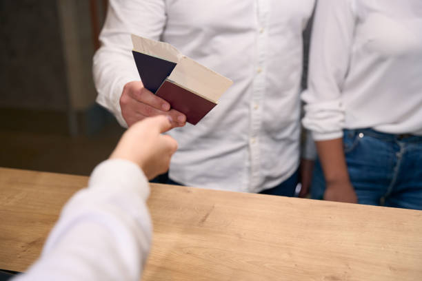 istock Male and female checking into hotel on arrival 1471424170