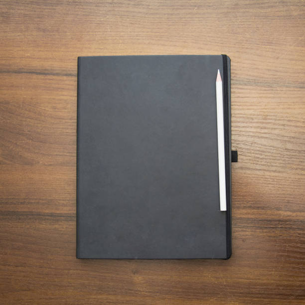 istock A beautiful pencil lies on a large notebook 1471426054