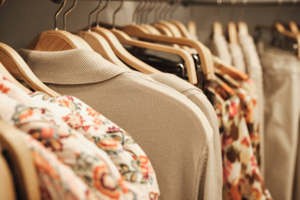 istock Clothes on hangers in a store. 1471426148