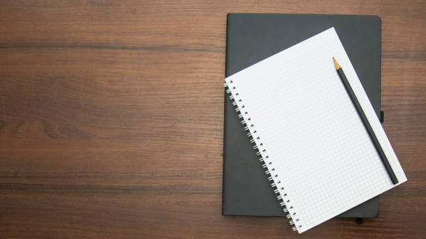 istock A beautiful pencil lies on a large notebook 1471426437