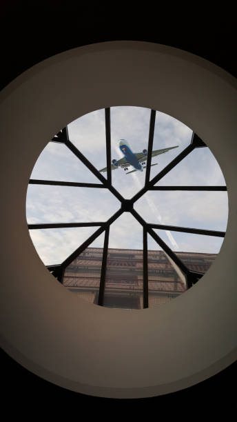 istock Aircraft over a skylight on approach to landing 1471426456