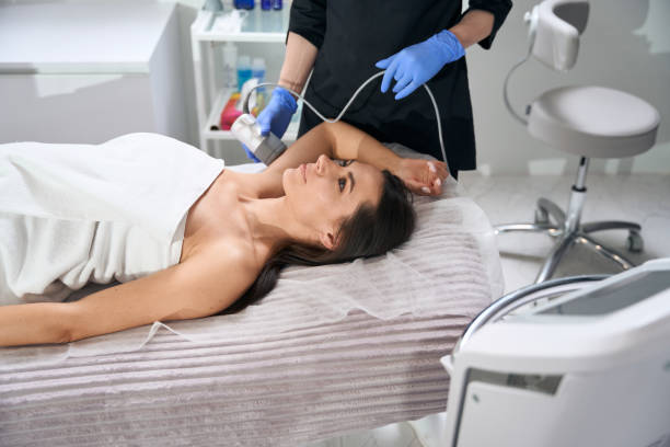 istock Nurse doing course of anti-aging procedures for female 1471428409