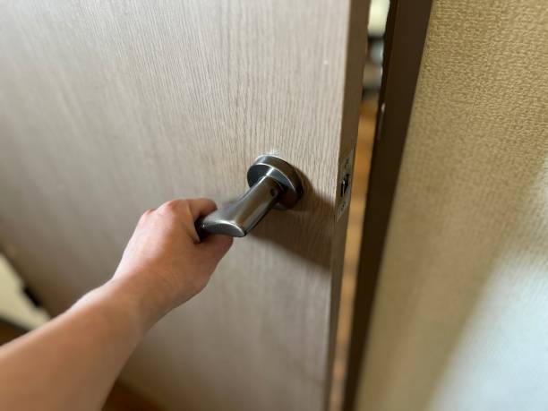istock Image of a woman opening a door 1471429652