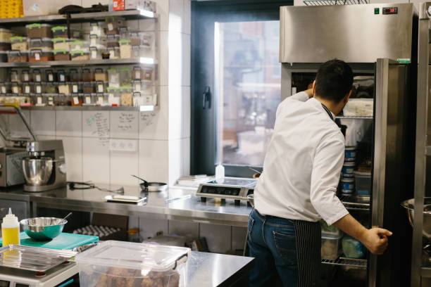 istock The chef prepares food in the modern spacious kitchen. 1471430398