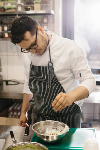 istock The chef prepares food in the modern spacious kitchen. 1471430430