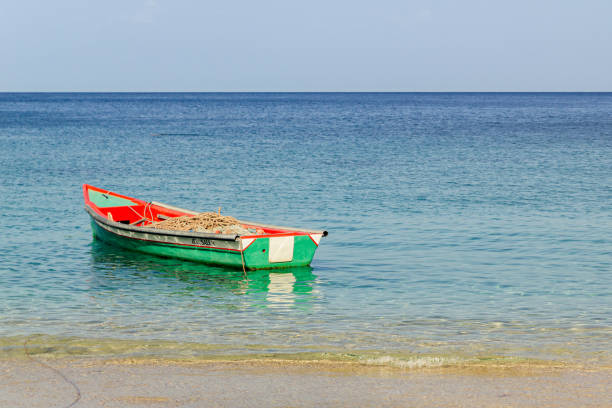 istock a fishing boat on turquoise water 1471430530