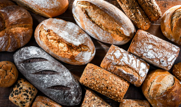 istock Assorted bakery products including loaves of bread and rolls 1471433920