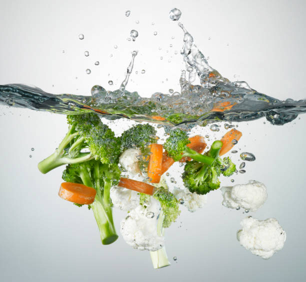 splashes and vegetables stock photo