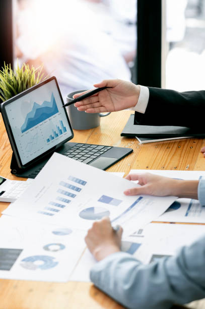 istock Young business teamwork working with business report document on office desk. People Design Planning, Brainstorming Planning Partnership. 1471434972