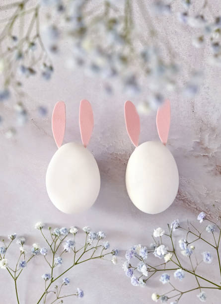 istock Easter composition of eggs and flowers on a light background. Easter bunny. A gentle greeting card for the Easter holiday.Top view, copy location, flat layout. 1471435246