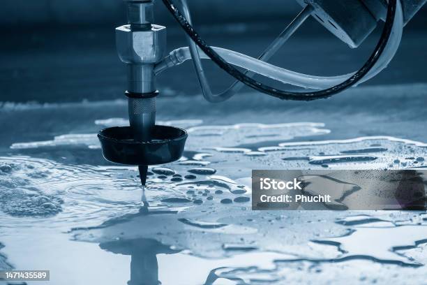 Closeup Scene Of Multiaxis Abrasive Waterjet Cutting Machine Cutting The Aluminum Plate Stock Photo - Download Image Now