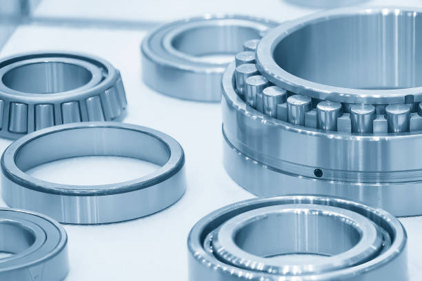 The cylindrical rolling bearing parts in light blue scene. stock photo