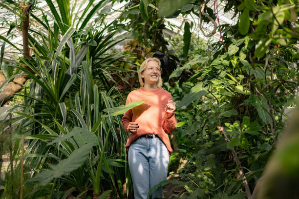 Free Stock Photo of Tranquil greenhouse with a thoughtful woman ...