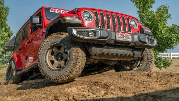 red jeep wrangler on a demo drive off-road. - editorial sports utility vehicle car jeep imagens e fotografias de stock