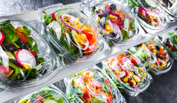 istock Boxes with pre-packaged vegetable salads in a commercial fridge 1471437219