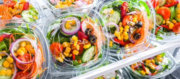 istock Boxes with pre-packaged vegetable salads in a commercial fridge 1471437236