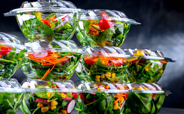istock Boxes with pre-packaged vegetable salads in a commercial fridge 1471437277