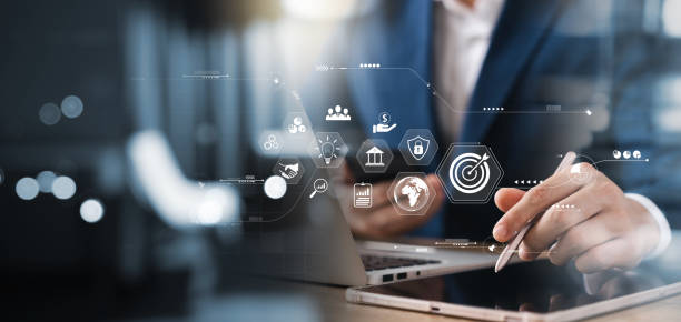 istock Businessman analyzing company's financial balance sheet working with digital augmented reality graphics. Businessman calculates financial data for long-term investment. 1471440751