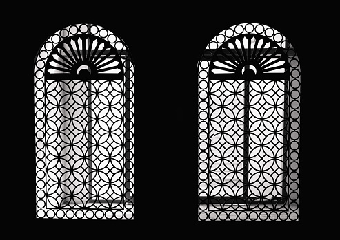 Dubai, United Arab Emirates - January 8, 2023: Black and White image of beautifully designed backlit pair of window at Madinat Jumeirah. Souq hosts variety of local stores including souvenir and gift shops. A very iconic architecture reflecting local culture and heritage values. This shopping arena also hosts various of cafes, restaurants and entertainment facilities.