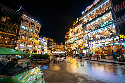 SAPA, Vietnam - September 20, 2022: Tourists and locals walking at the square in the center of Sapa at the evening, Night life in sapa, Vietnam