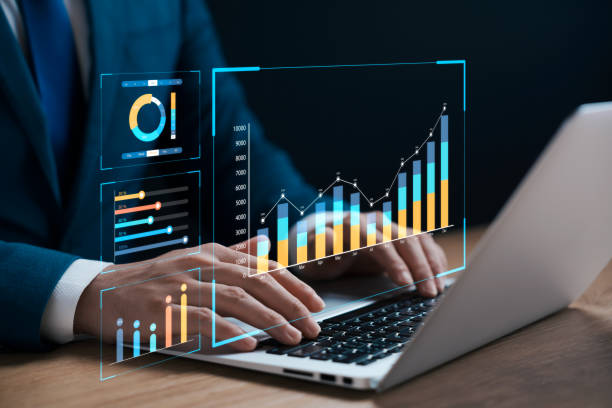 istock businessman analyzing business Enterprise data management, business analytics with charts, metrics and KPIs to improve organizational performance, marketing, financial organization strategy. 1471442739
