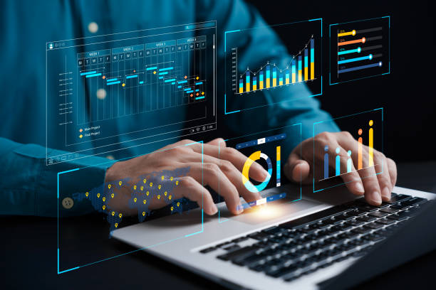 istock businessman analyzing business Enterprise data management, business analytics with charts, metrics and KPIs to improve organizational performance, marketing, financial organization strategy. 1471443813