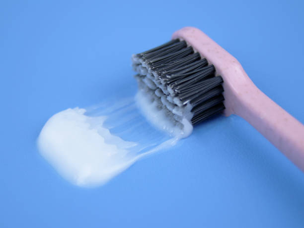 istock close up of toothbrush on blue background 1471446504