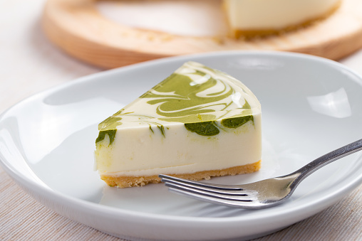 Slice of no bake matcha green tea cheesecake