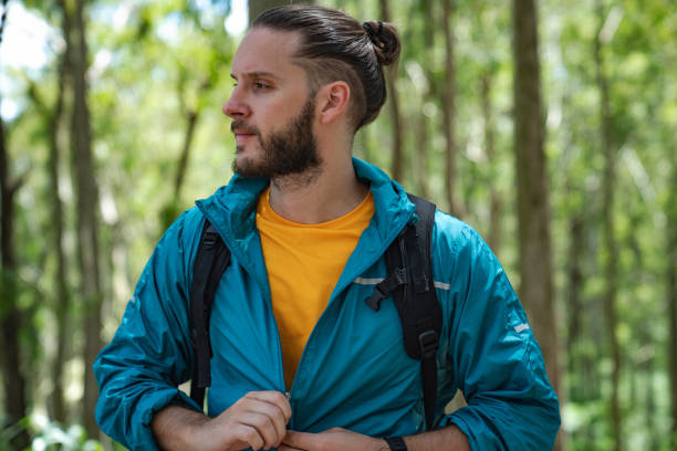 istock Active young man in sportswear in the forest. 1471448717