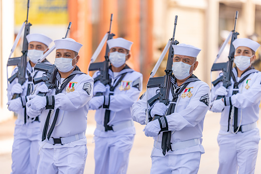 Matamoros, Tamaulipas, Mexico - September 16, 2022: Desfile 16 de Septiembre, Members of the Mexican Navy marching with their rifles during the parade