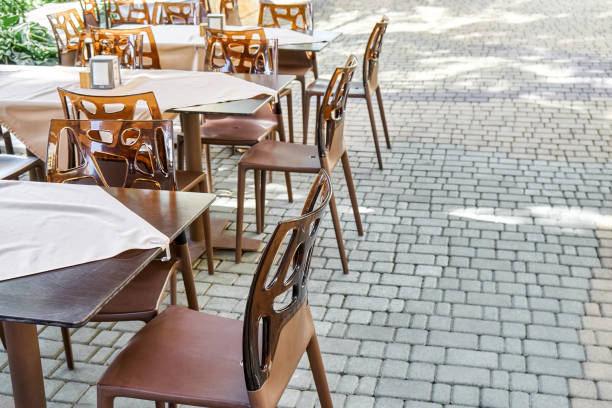 istock Chairs and empty tables in open air restaurant in summer 1471452131