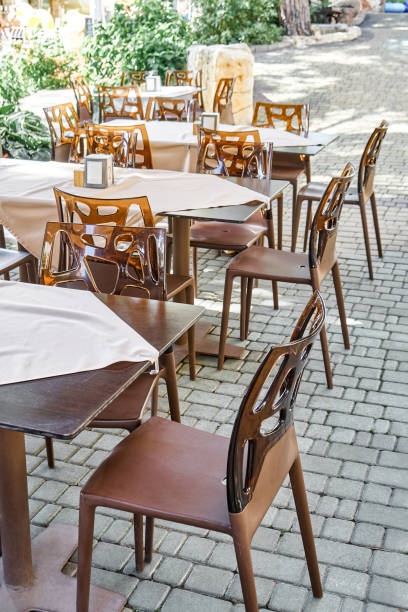 istock Chairs and empty tables in open air restaurant in summer 1471452880