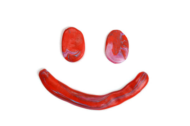 Smiling plasticine emotion isolated on white background