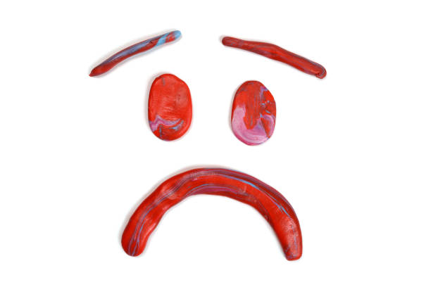 sad emotion from red plasticine isolated on white