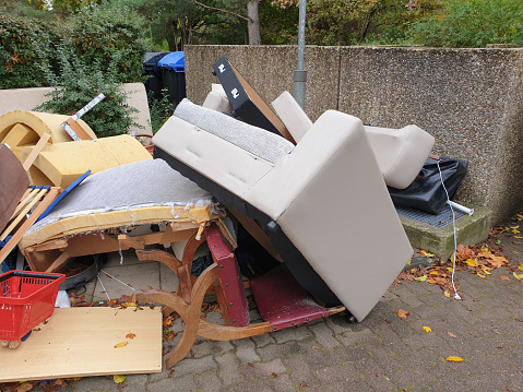 Bulky waste, garbage, unnecessary furniture, big trash on streets of Germany.