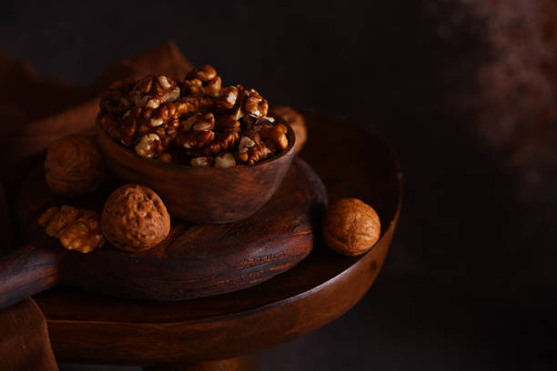 peeled walnuts in a wooden bowl, rustic style