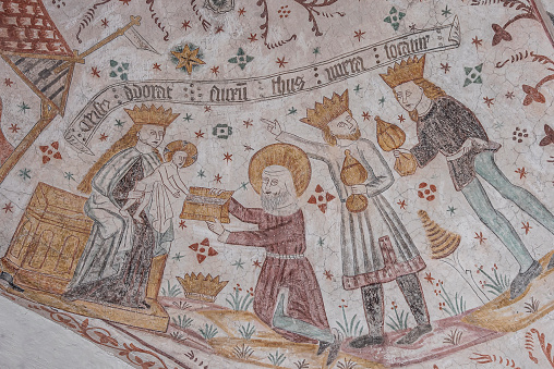 three weise men with gifts to the christ-child, ancient wall-painting in Keldby church, Denmark, October 10, 2022