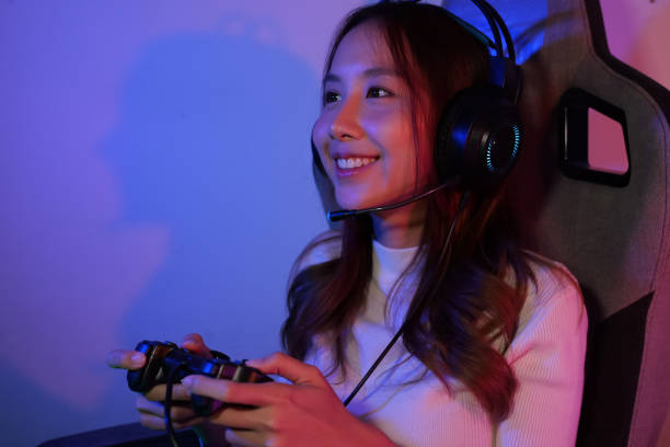 istock Young female game streamer playing online game on computer at home 1471460022