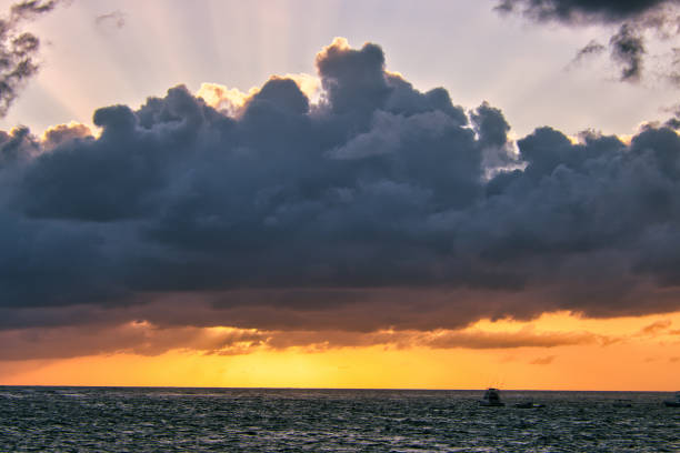 Punta Cana, Dominican Republic - February 21, 2023. Sunrise view over the caribbean sea, white sand beaches and palm trees.