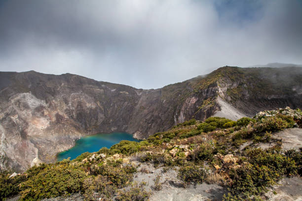 irazu volcano crater lake, costa rica at the edge of irazu volcano crater lake in costa rica. irazu stock pictures, royalty-free photos & images