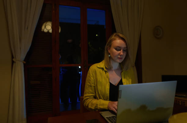 istock Woman works and does not notice intruder behind her back. 1471463288