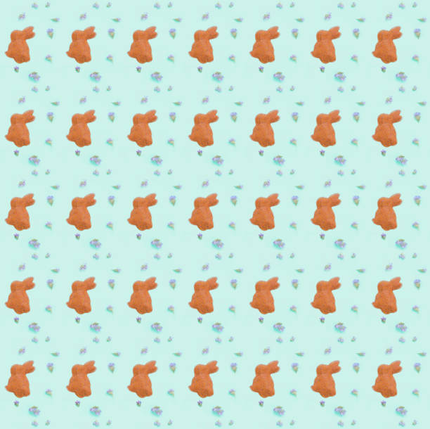 istock Pattern of rabbit figurine on green background. Happy Easter concept. 1471463295