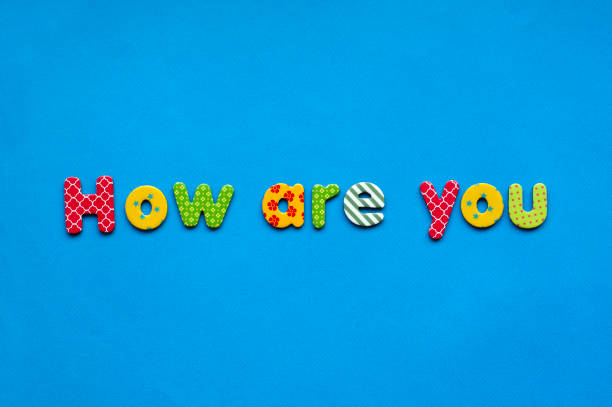 istock text how are you from bright colored paper letters on blue paper background 1471463340
