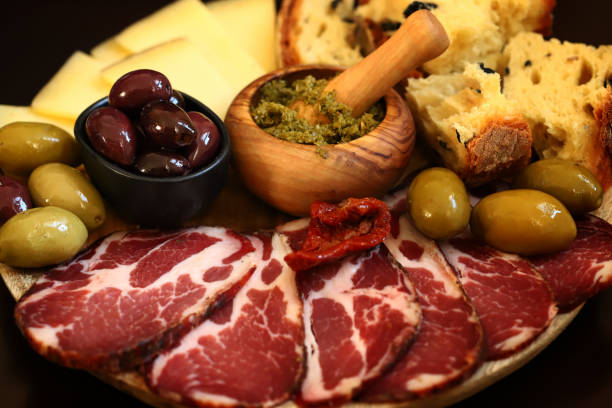 istock Italian board. Cheese, ham, olives, Italian bread. 1471466439