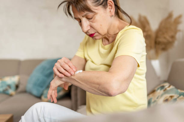 istock Woman applying estrogen cream on her forearm 1471471839