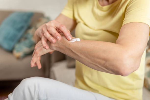 istock Woman applying estrogen cream on her forearm 1471472113