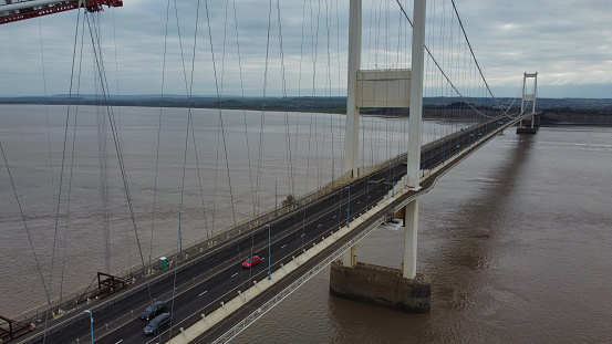 Drone point of view of suspension bridge carrying M4 motorway