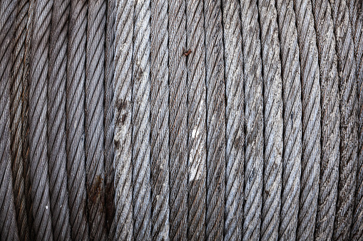 Steel cable wound on a reel, close-up. The texture of the steel cable.